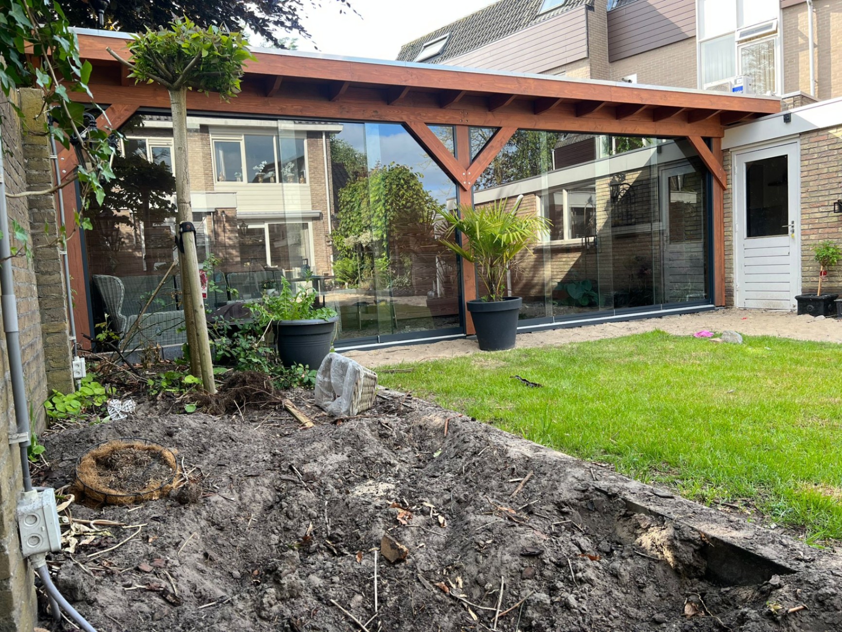 Tuinrenovatie met veranda in aanbouw